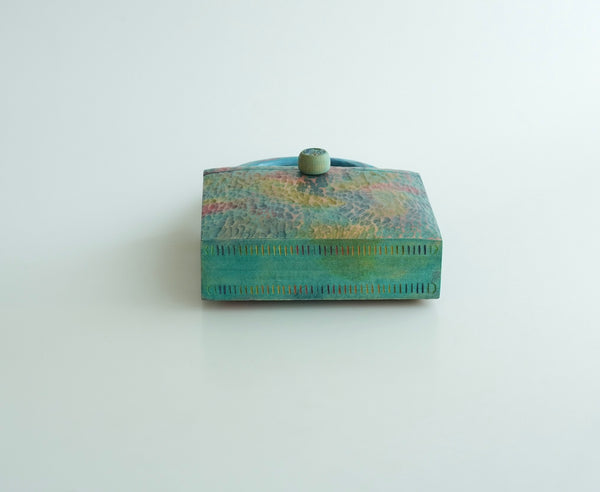 樹の鞄 　虹色の雲