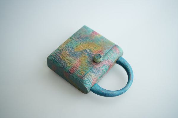 樹の鞄 　虹色の雲